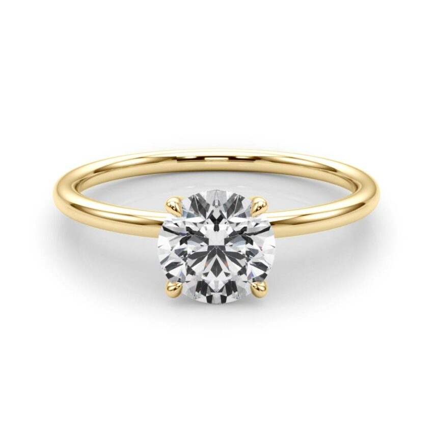 round cut diamond dainty solitaire engagement ring in yellow gold
