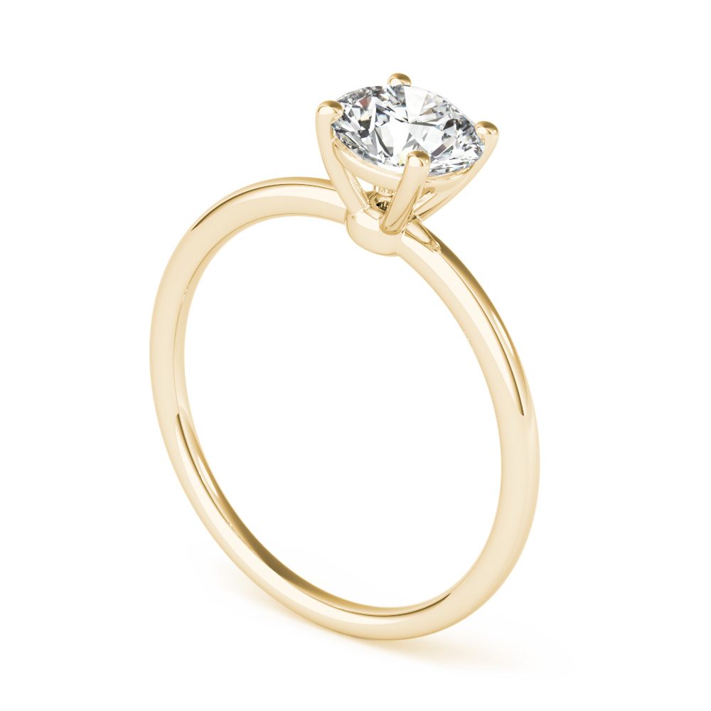 angle view of round cut diamond dainty solitaire engagement ring in yellow gold