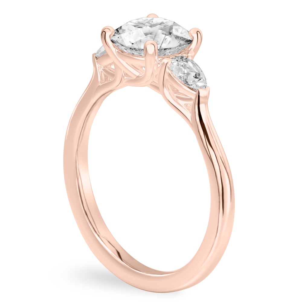 round cut diamond pear side stone engagement ring rose gold angle