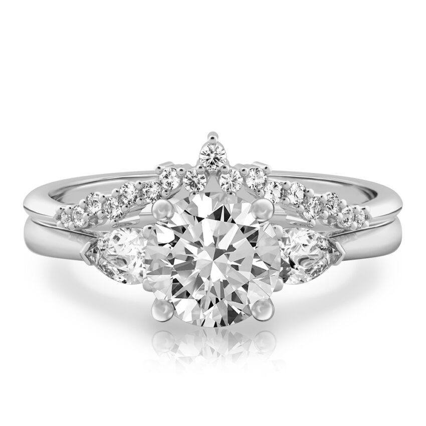 round cut diamond pear side stone engagement ring set white gold