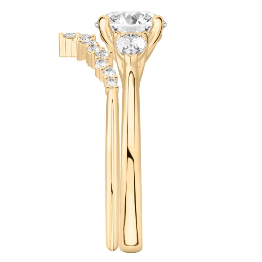 round cut diamond pear side stone engagement ring set yellow gold side