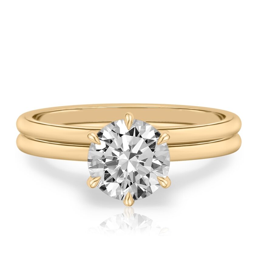 round cut diamond six prong delicate solitaire engagement ring set yellow gold