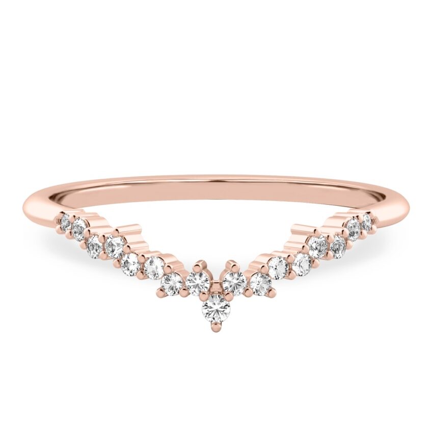 scattered diamonds across curved chevron wedding band in rose gold