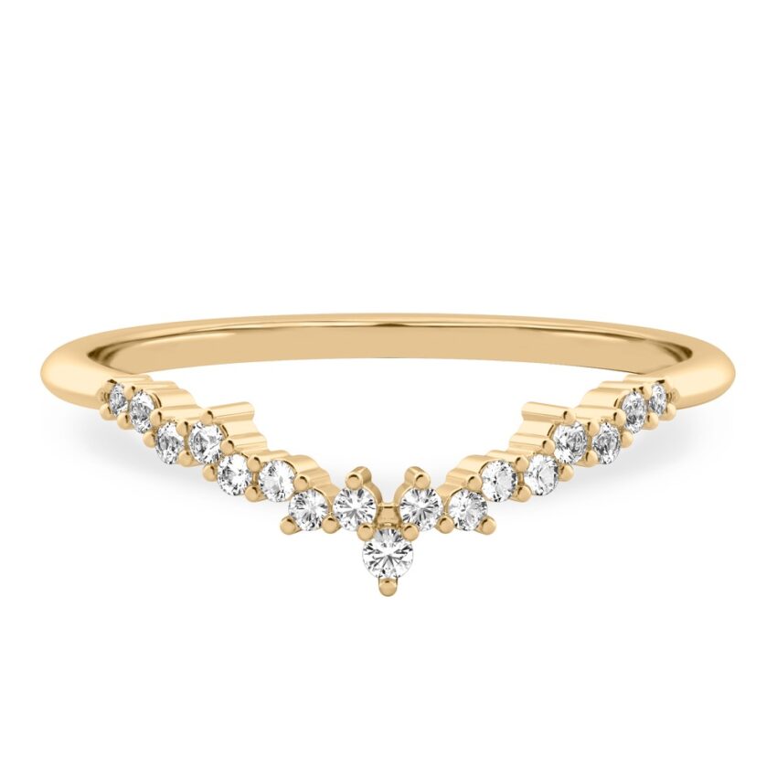 scattered diamonds across curved chevron wedding band in yellow gold