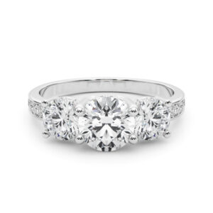 round cut diamond three stone hidden halo engagement ring platinum