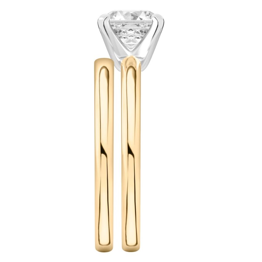 Side view of asscher cut diamond classic solitaire engagement ring set yellow gold