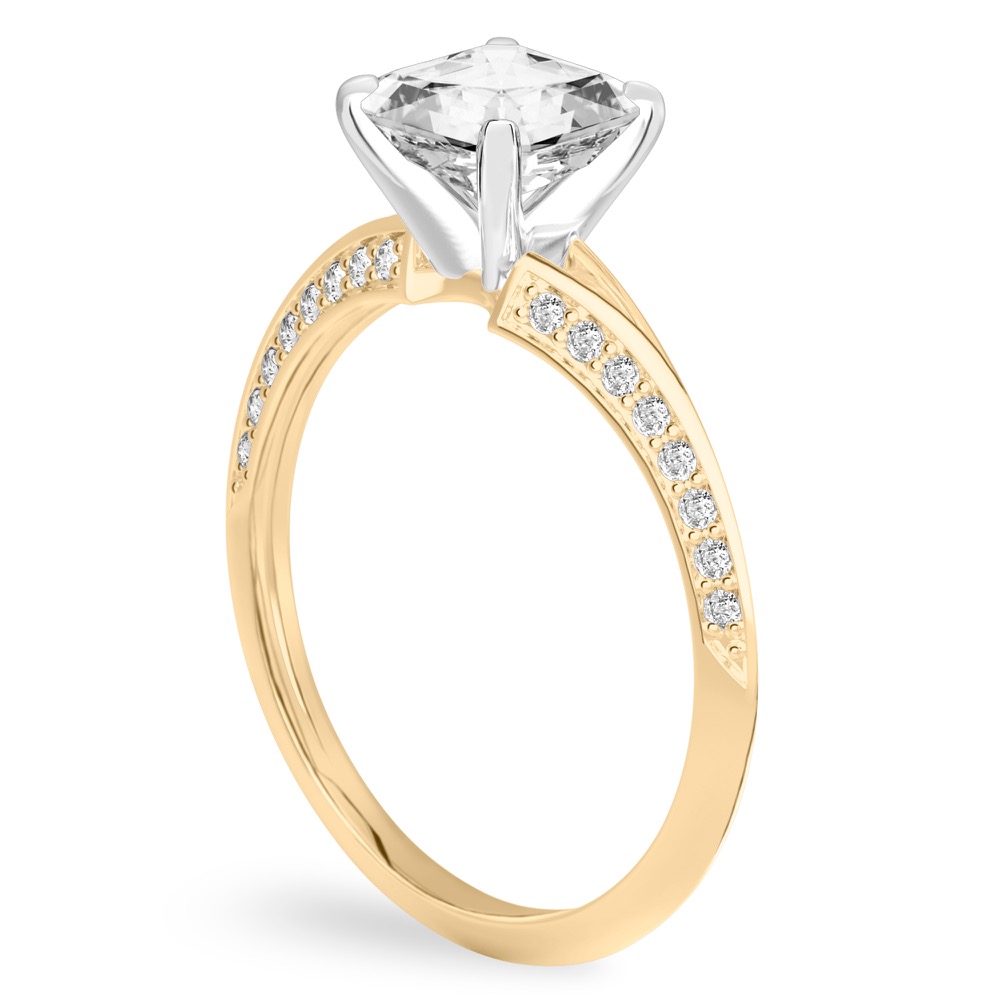 Angle view of asscher cut diamond split shank knife edge engagement ring in yellow gold