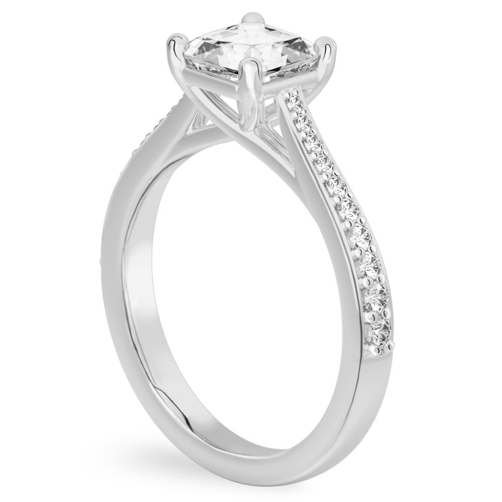 Angle view of asscher cut diamond tapered engagement ring in platinum