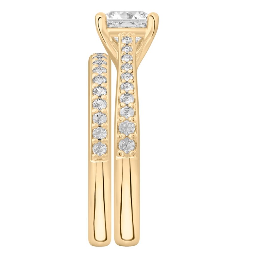 Side view of asscher cut diamond tapered engagement ring set yellow gold
