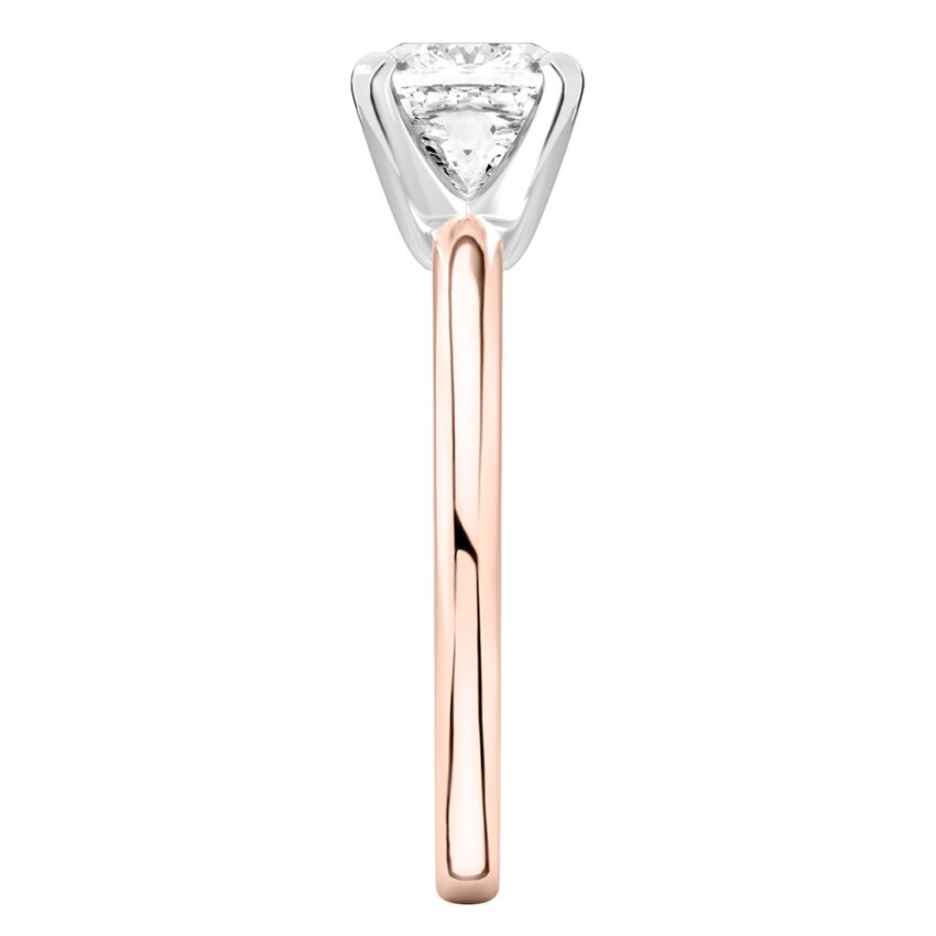 Side view of cushion cut diamond classic solitaire engagement ring in rose gold