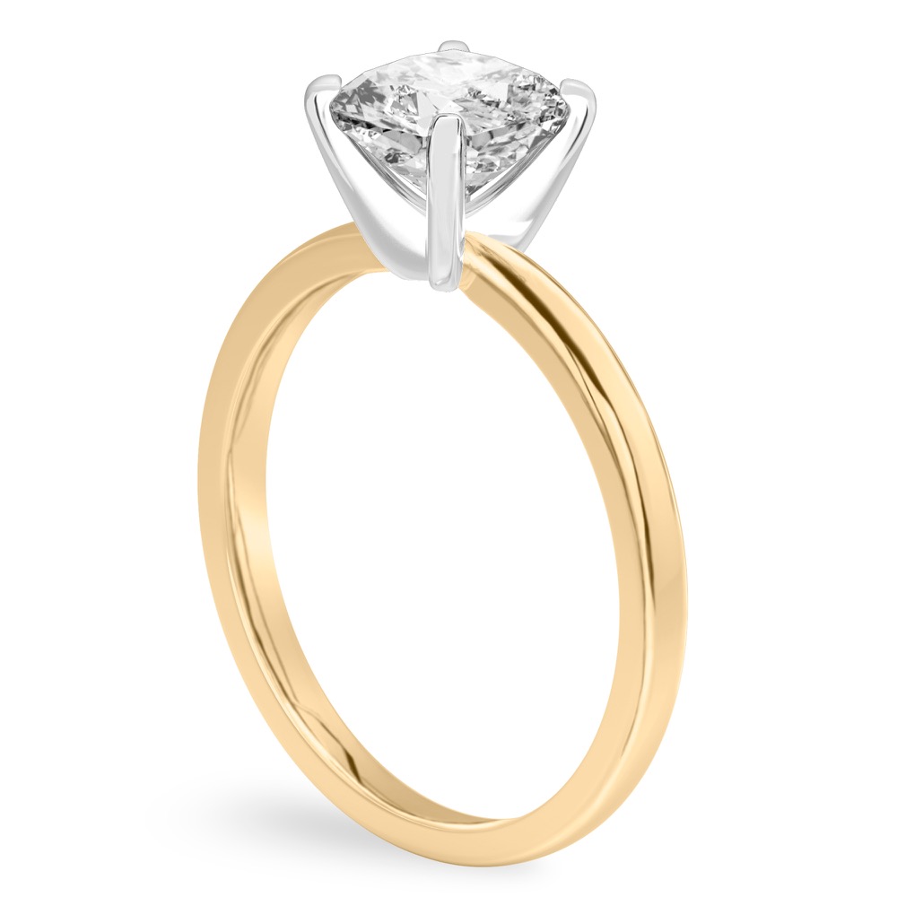 Angle view of cushion cut diamond classic solitaire engagement ring in yellow gold