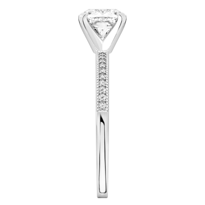 Side view of cushion cut diamond petite milgrain diamond engagement ring in platinum