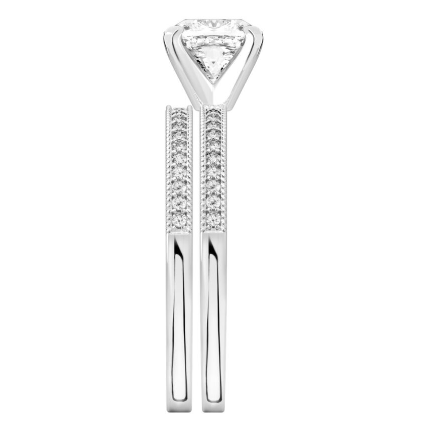 Side view of cushion cut diamond petite milgrain diamond engagement ring set platinum