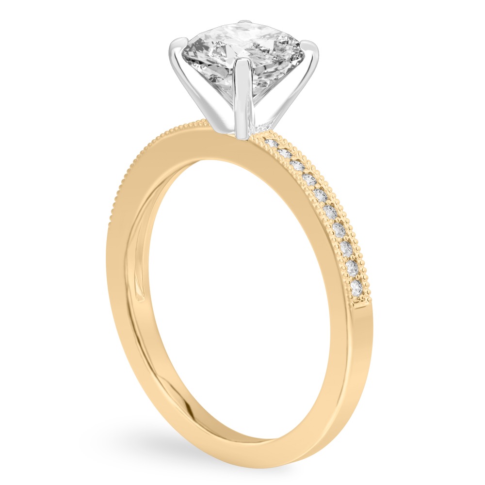 Angle view of cushion cut diamond petite milgrain diamond engagement ring in yellow gold