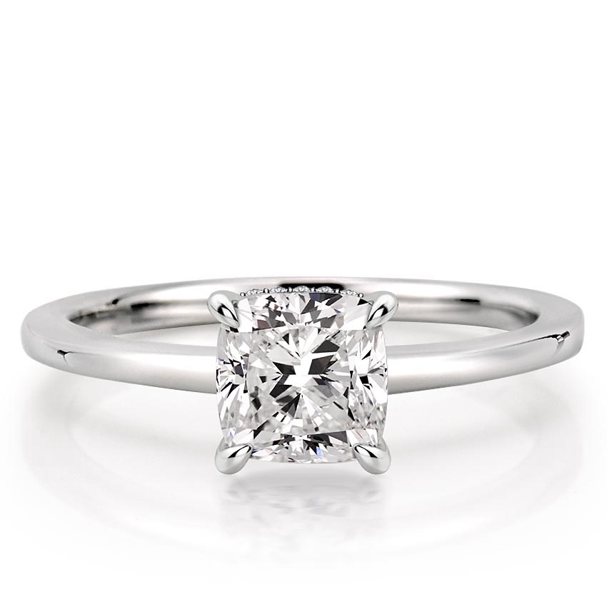 cushion cut diamond secret halo engagement ring in platinum