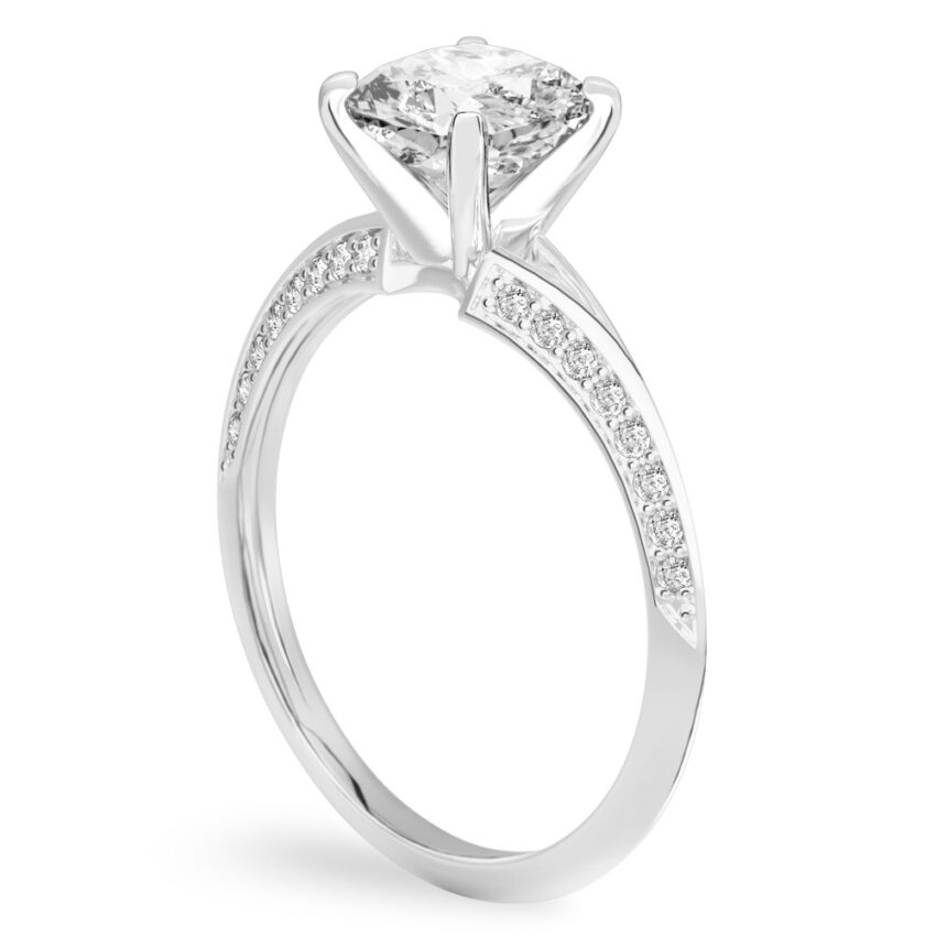 Angle view of cushion cut diamond split shank knife edge engagement ring in palladium