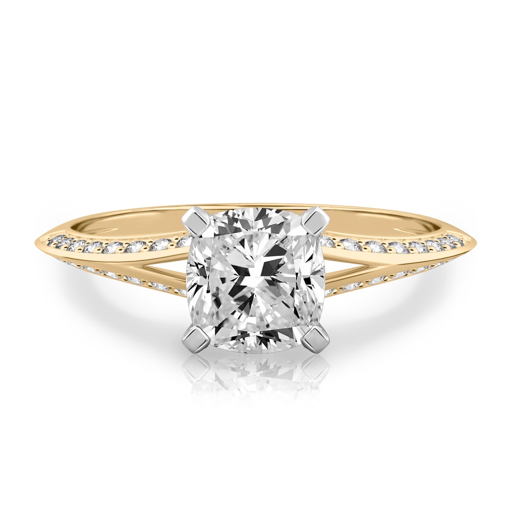 cushion cut diamond split shank knife edge engagement ring in yellow gold