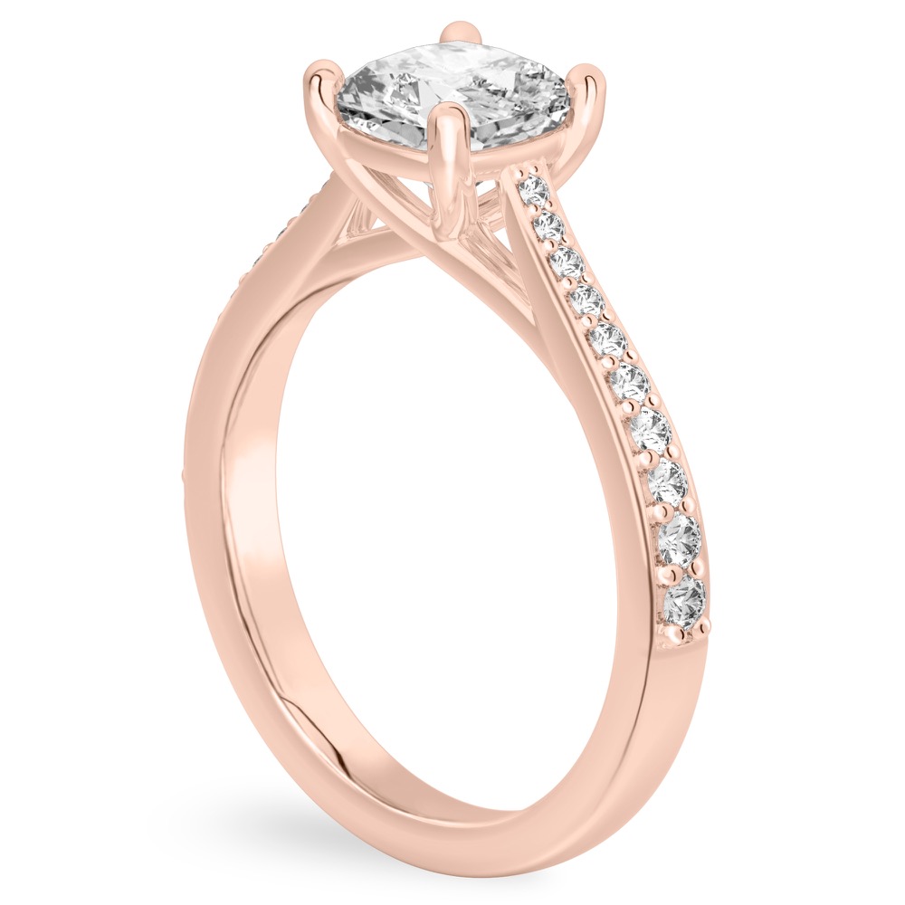 Angle view of cushion cut diamond tapered engagement ring in rose gold