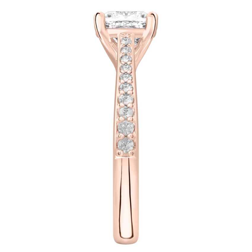 Side view of cushion cut diamond tapered engagement ring in rose gold