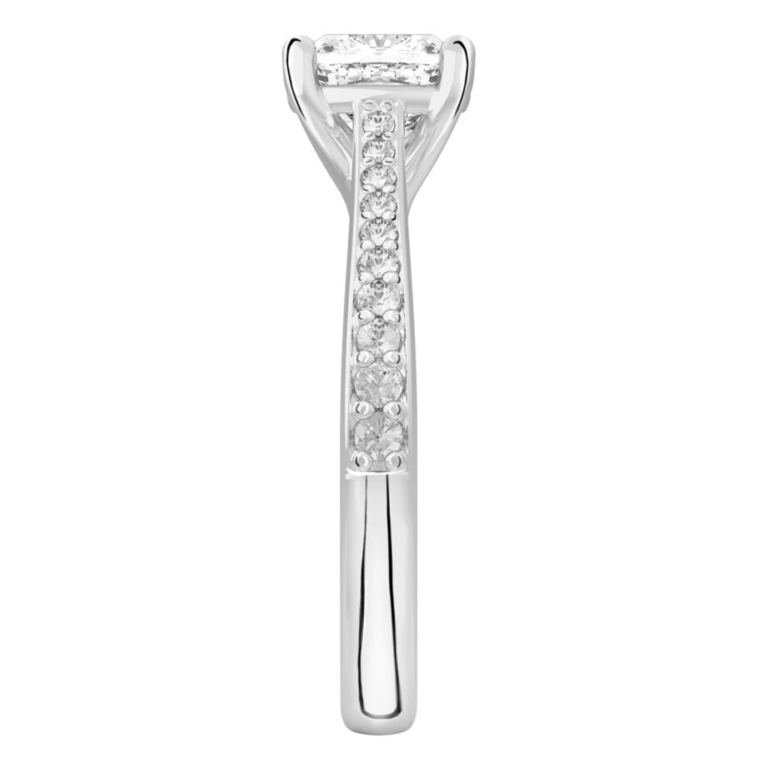 Side view of cushion cut diamond tapered engagement ring in white gold