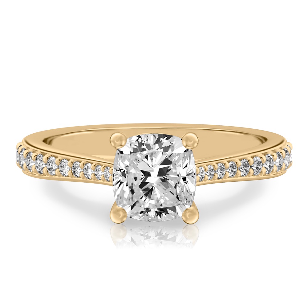 cushion cut diamond tapered engagement ring in yellow gold