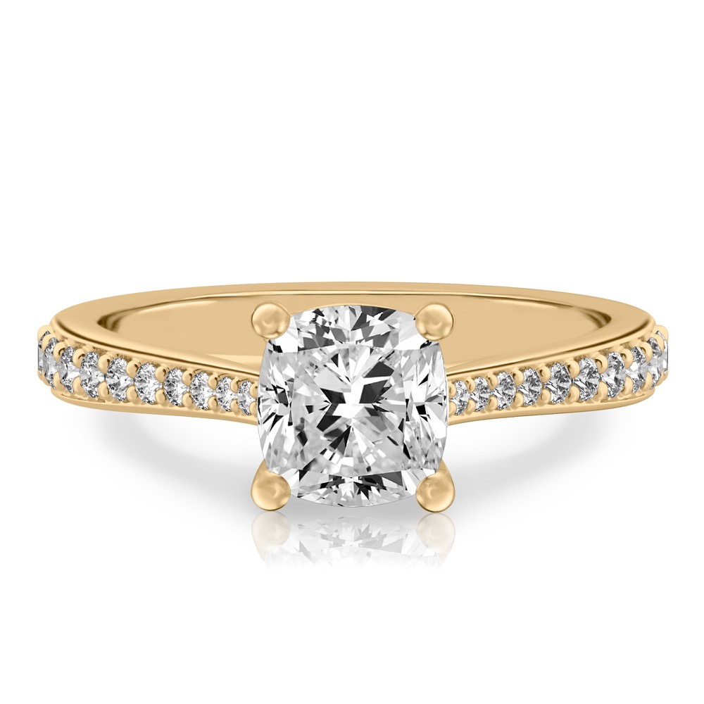 cushion cut diamond tapered engagement ring in yellow gold