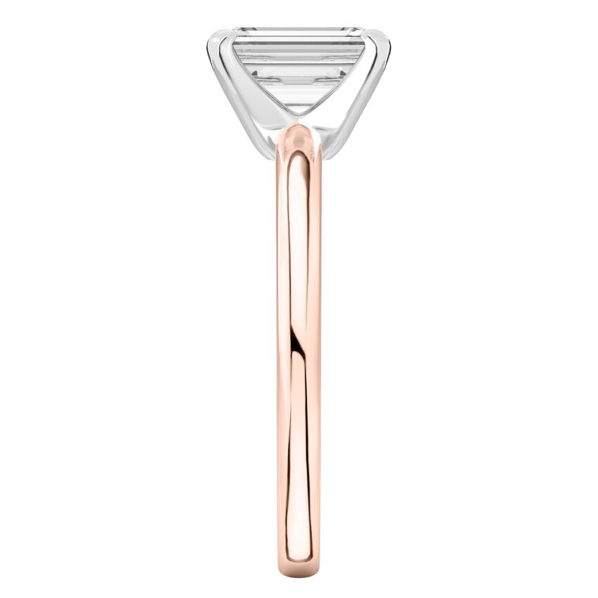 Side view of emerald cut diamond classic solitaire engagement ring in rose gold