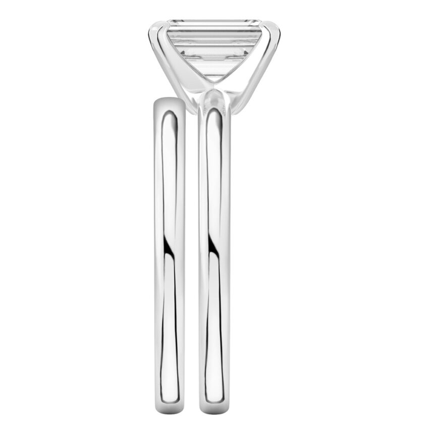 Side view of emerald cut diamond classic solitaire engagement ring set palladium