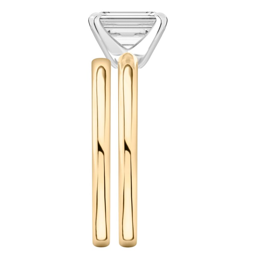Side view of emerald cut diamond classic solitaire engagement ring set yellow gold