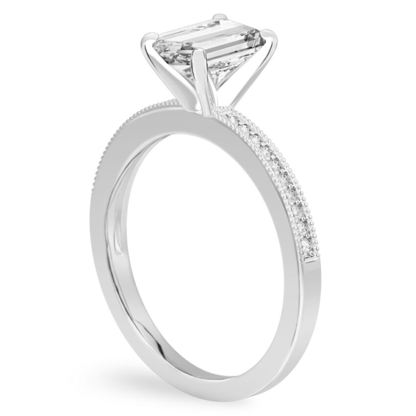 Angle view of emerald cut diamond petite milgrain diamond engagement ring in palladium