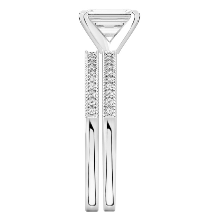 Side view of emerald cut diamond petite milgrain diamond engagement ring set white gold