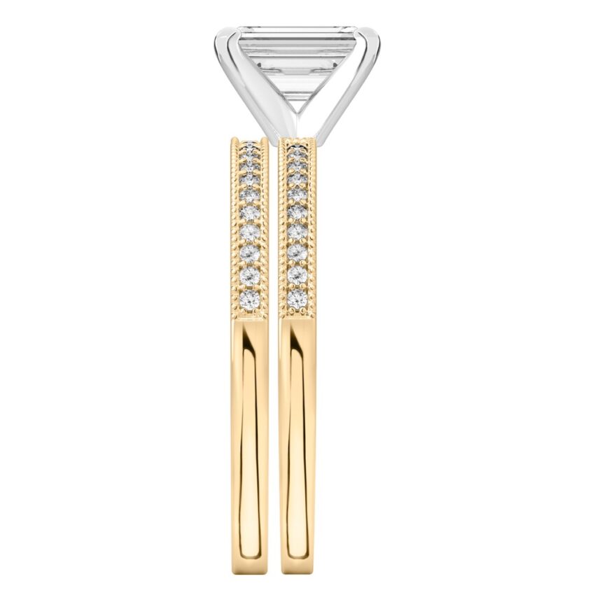 Side view of emerald cut diamond petite milgrain diamond engagement ring set yellow gold
