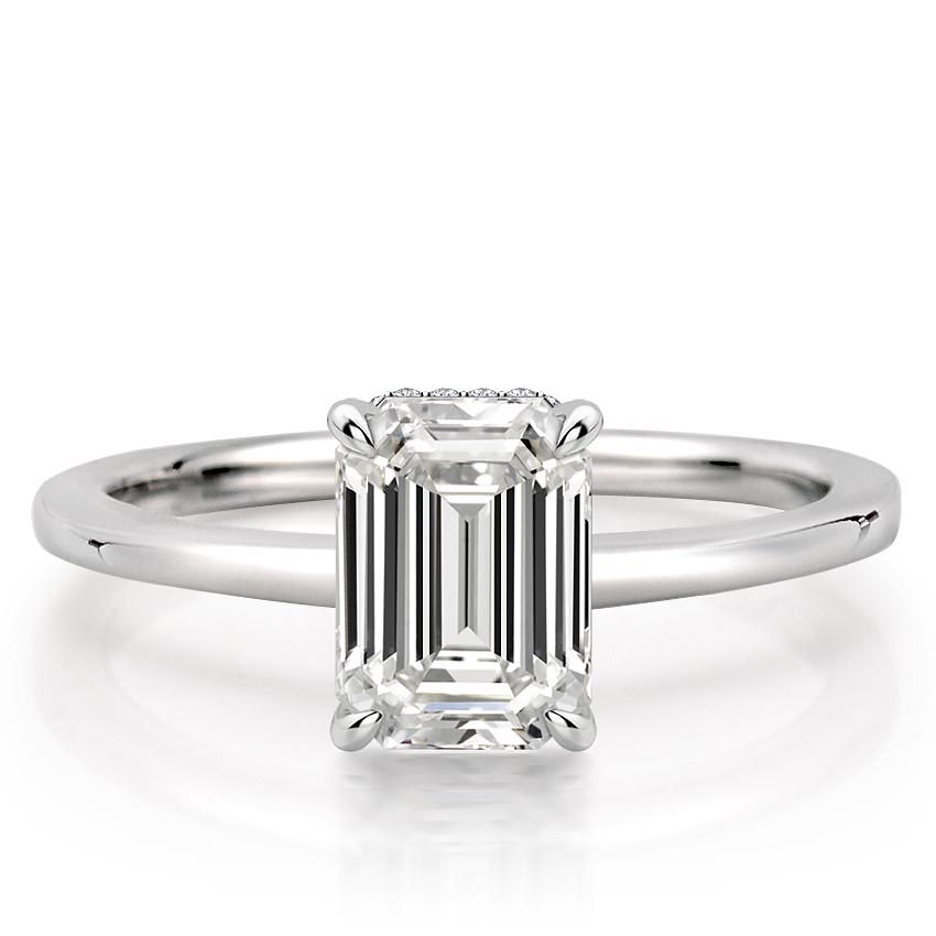 emerald cut diamond secret halo engagement ring in white gold