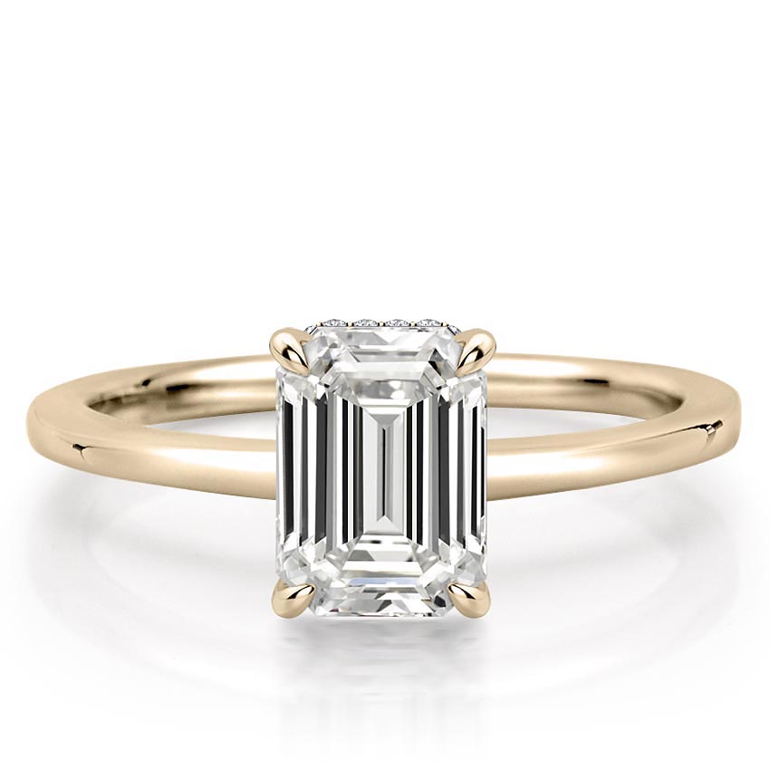 emerald cut diamond secret halo engagement ring in yellow gold