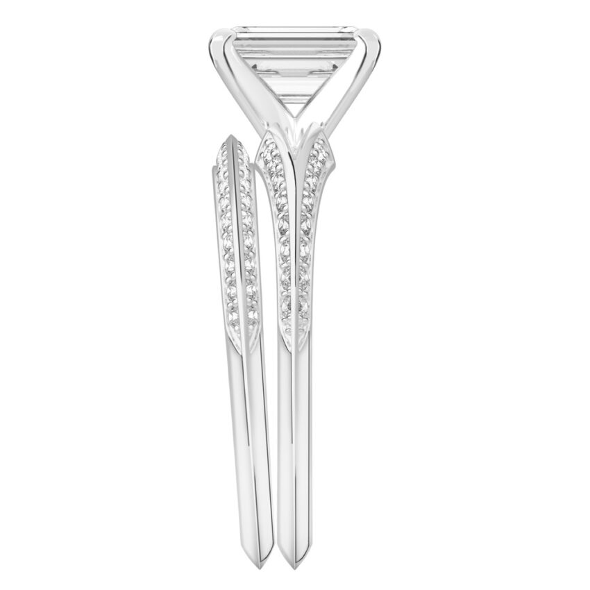 Side view of emerald cut diamond split shank knife edge engagement ring in set white gold