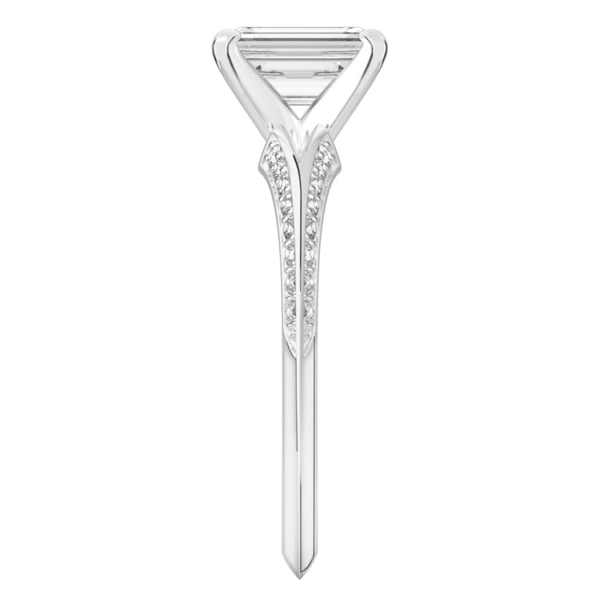 Side view of emerald cut diamond split shank knife edge engagement ring in white gold