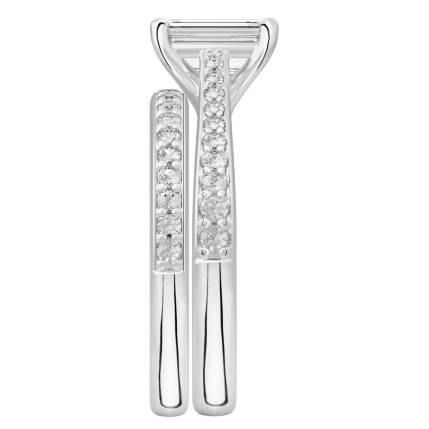 Side view of emerald cut diamond tapered engagement ring set white gold