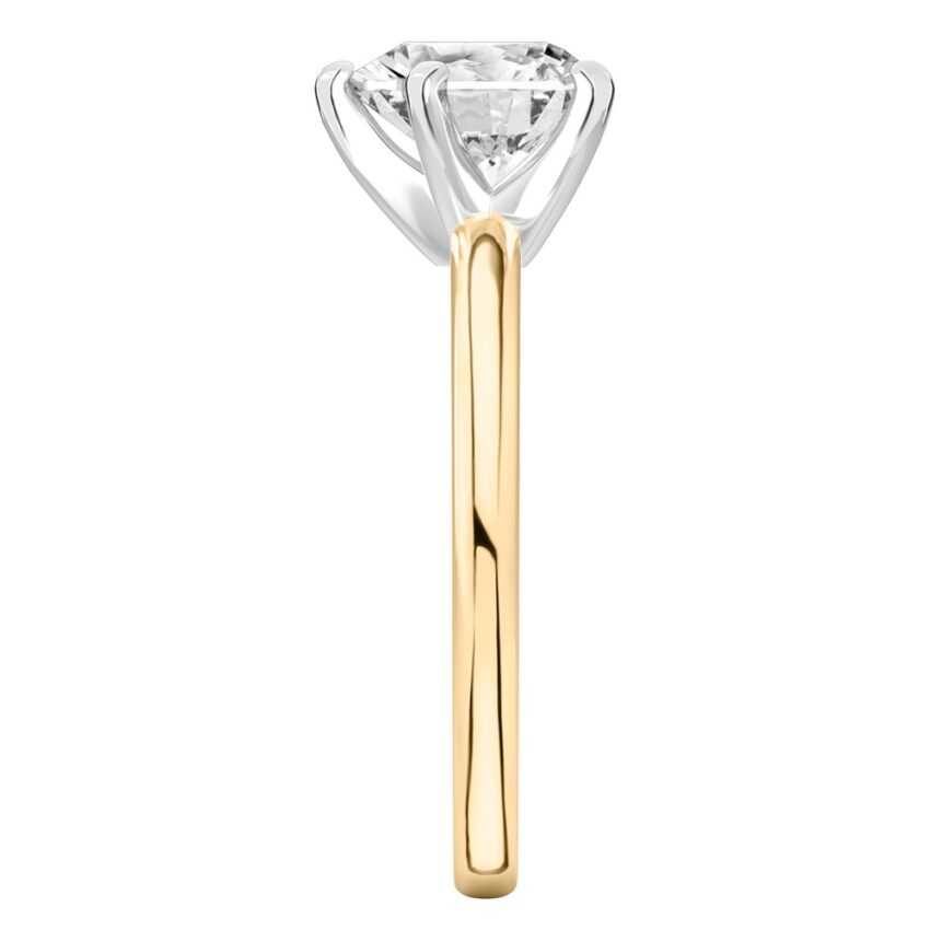 Side view of heart shape diamond classic solitaire engagement ring in yellow gold