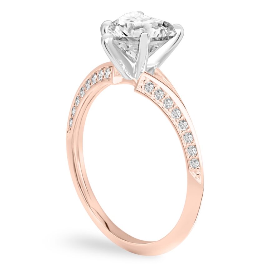Angle view of heart shape diamond split shank knife edge engagement ring in rose gold