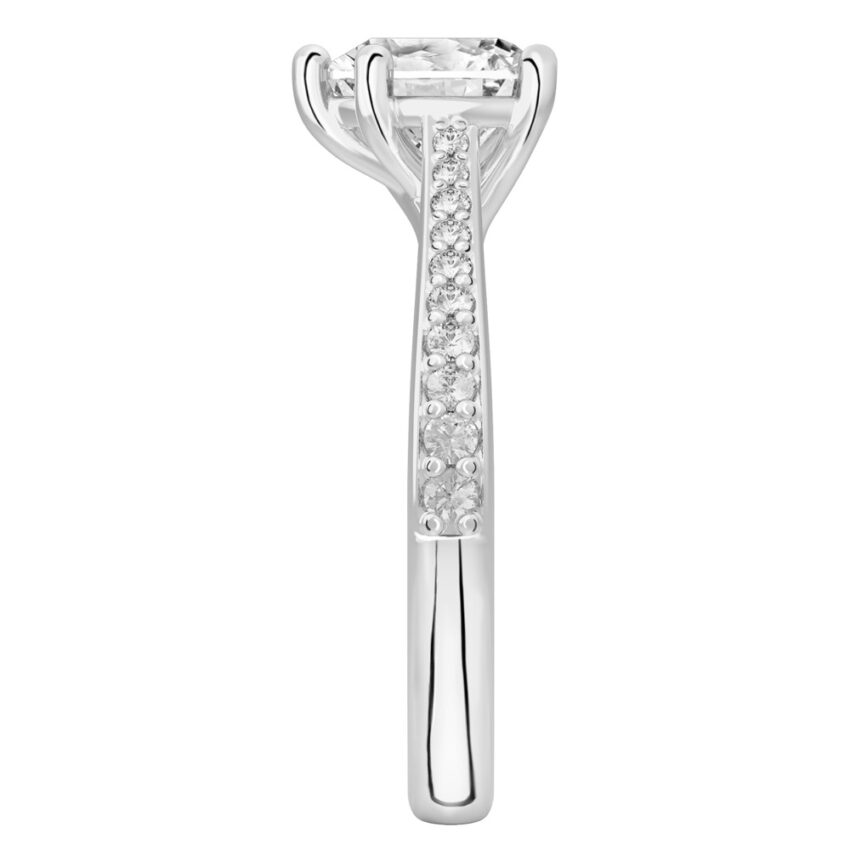 Side view of heart shape diamond tapered engagement ring in platinum