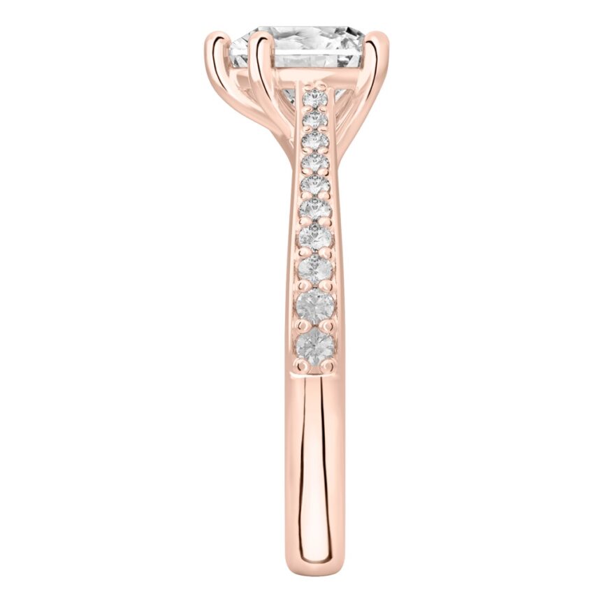 Side view of heart shape diamond tapered engagement ring in rose gold