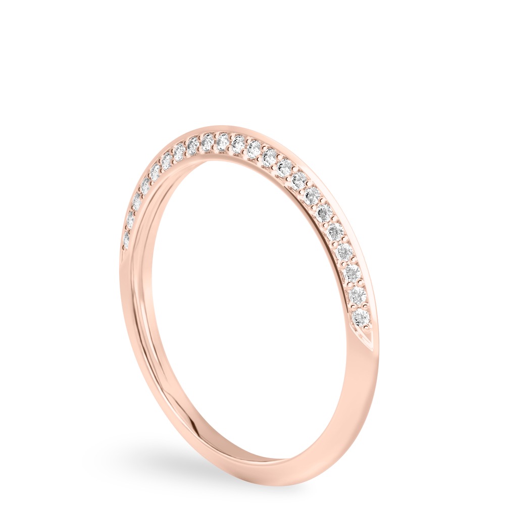 Angle view of knife edge wedding band in with diamonds rose gold