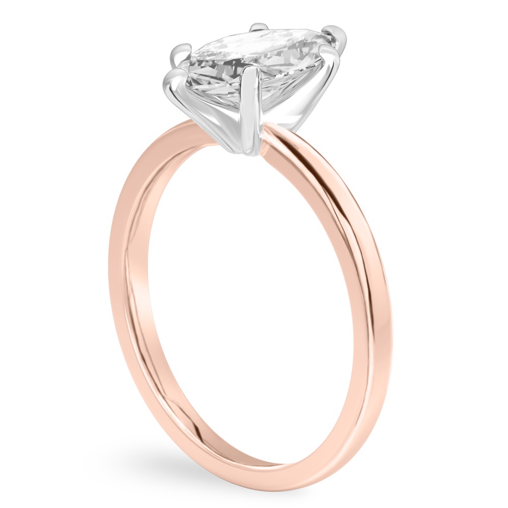 Angle view of marquise cut diamond classic solitaire engagement ring in rose gold