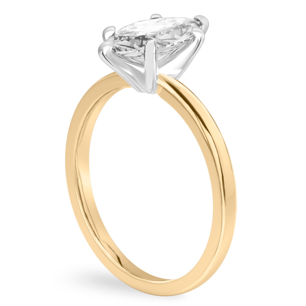 Angle view of marquise cut diamond classic solitaire engagement ring in yellow gold