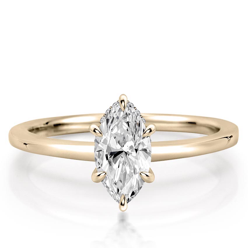 marquise cut diamond secret halo engagement ring in yellow gold