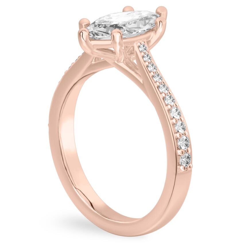 Angle view of marquise cut diamond tapered engagement ring in rose gold