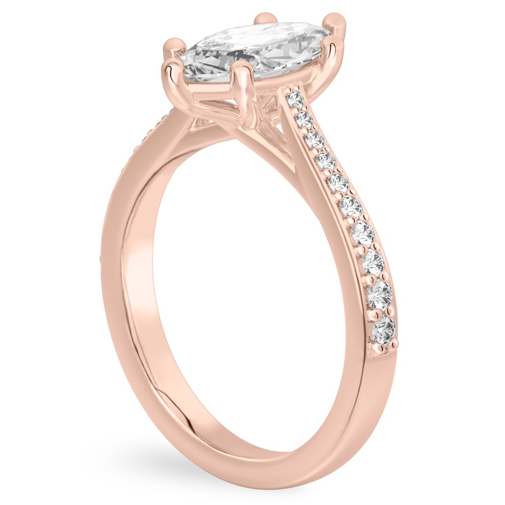 Angle view of marquise cut diamond tapered engagement ring in rose gold