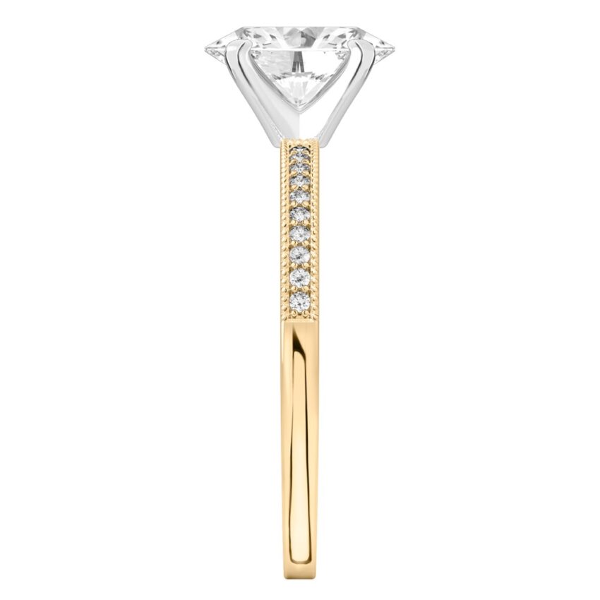 Side view of oval shape diamond petite milgrain diamond engagement ring in yellow gold