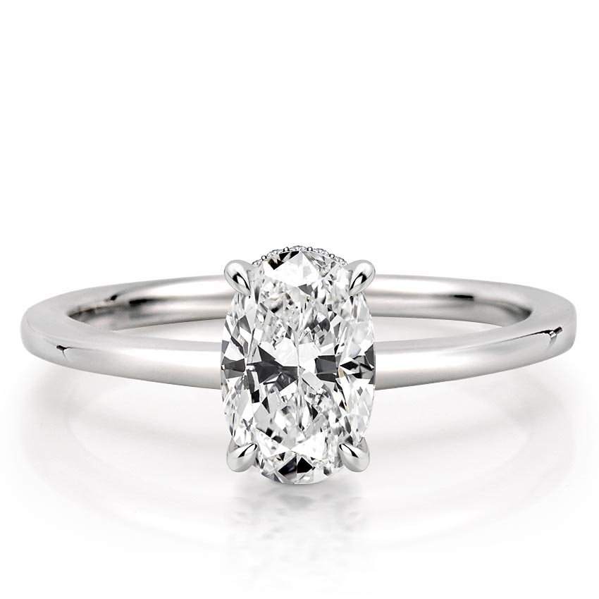 oval shape diamond secret halo engagement ring in white gold