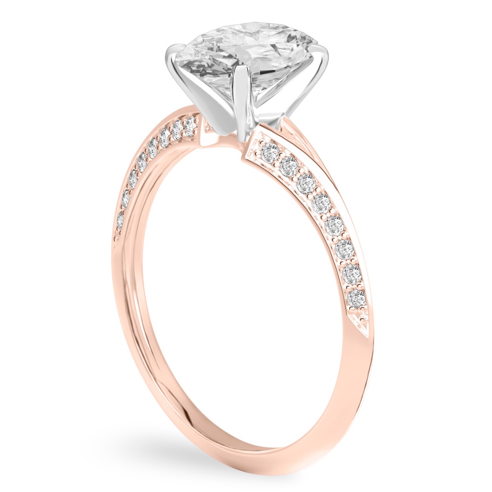 Angle view of oval shape diamond split shank knife edge engagement ring in rose gold